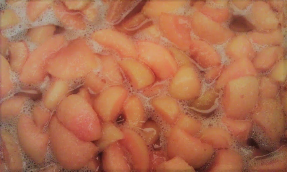 Apricot jam, just coming to the boil