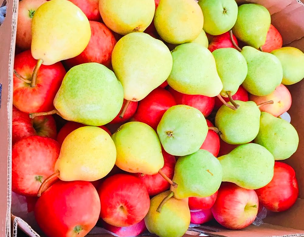 Mixed apples and pears in a box