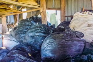 black bags full of fruit tree net stored in the shed