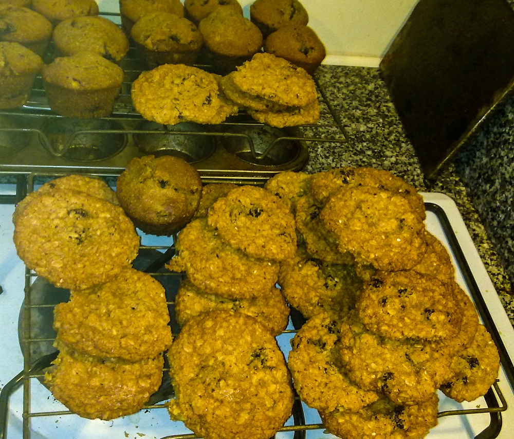 Dried cherry and oatmeal cookies, with cherry muffins in the background