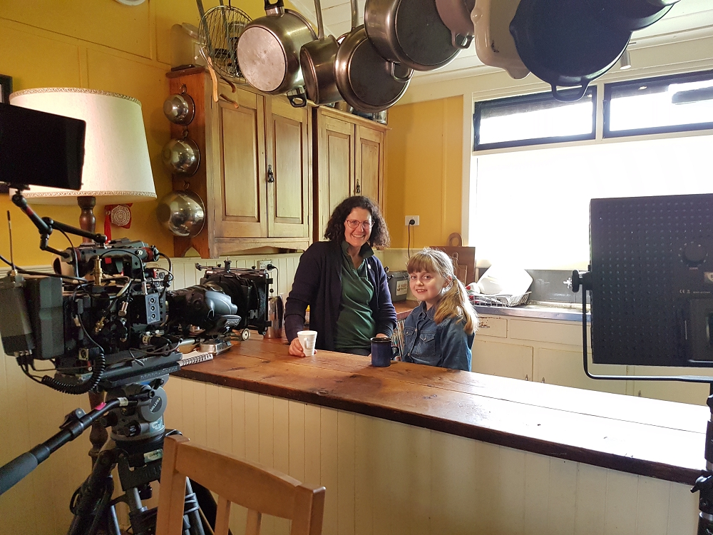 Katie and Miley in the kitchen being filmed for ABC ME series "If you see it you can be it"